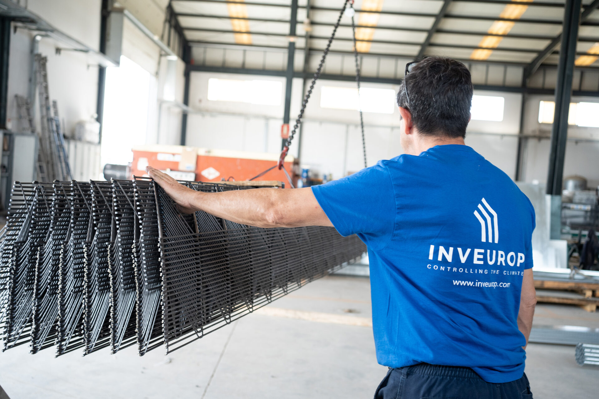 a man holding a metal mesh